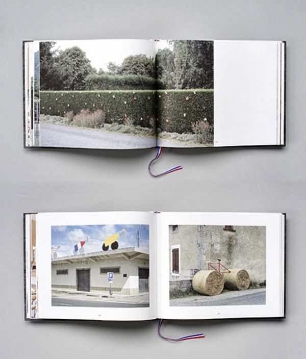 A reader lifting a translucent vellum sheet over a photograph