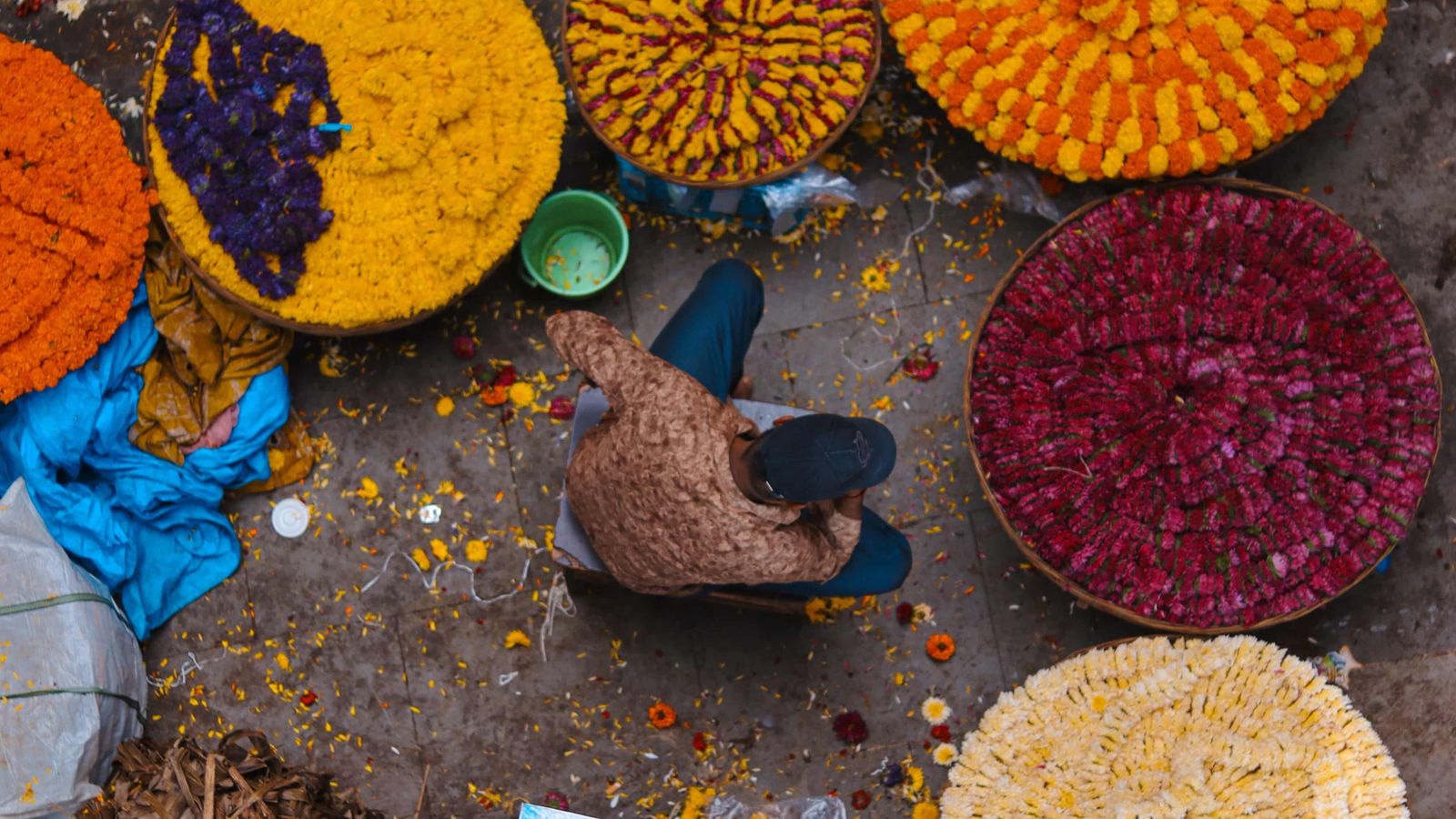 An overhead photograph of a Bangalore flower and colour vendor