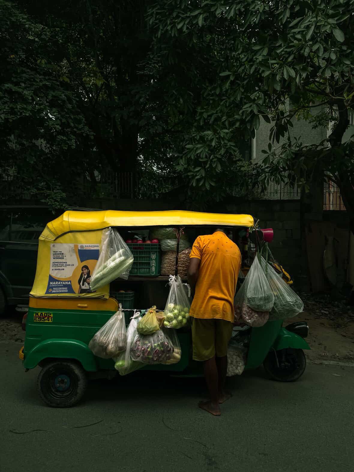 A loaded autorickshaw at dusk